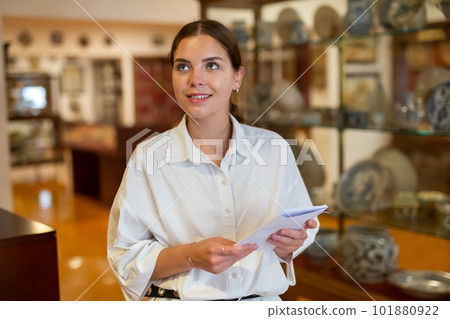 Woman looking at stone architectural elements in historical museum 101880922