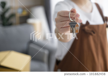 Woman owner buy purchase home, relocate to dwelling, rental, rent, ownership concept Woman owner buy purchase home, relocate to dwelling, rental, rent, ownership concept 101882438