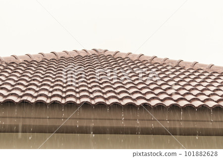 rain falling down from the house roof rain falling down from the house roof 101882628