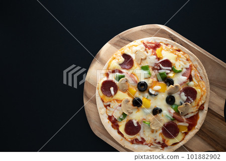Milanese-style pizza with a thin crust 101882902