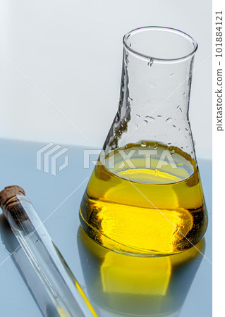 Medical tubes with liquid stand on mirror table. Chemical and laboratory analyses. Experiments and Medical tubes with liquid stand on mirror table. Chemical and laboratory analyses. Experiments and 101884121