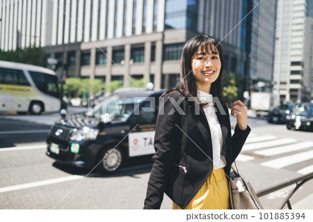 A young lady walking in the city A young lady walking in the city 101885394