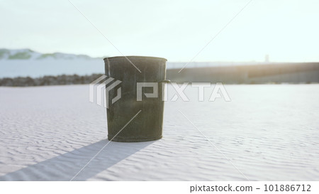 Gray metal garbage bin or trash can on the beach Gray metal garbage bin or trash can on the beach 101886712