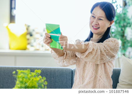 A woman glad to see a passbook A woman glad to see a passbook 101887546