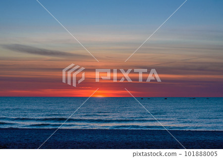 Spectacular bright golden sunset over Baltic sea Spectacular bright golden sunset over Baltic sea 101888005