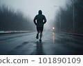 athlete runnerforest trail in the rain 101890109