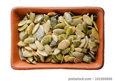 Pepitas in clay bowl isolated on white flat lay view 101890666