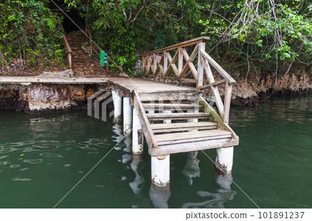 An empty small wooden pier with stairs. Dominican republic An empty small wooden pier with stairs. Dominican republic 101891237
