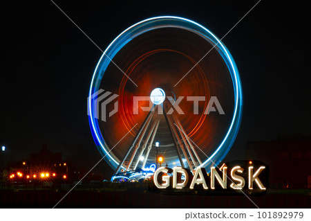 rotating ferris wheel at night rotating ferris wheel at night 101892979