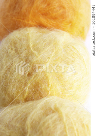 Yellow orange mohair yarn ball close-up image Yellow orange mohair yarn ball close-up image 101894445