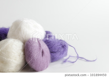 Mohair white and purple ball of yarn taken with a white background Mohair white and purple ball of yarn taken with a white background 101894450