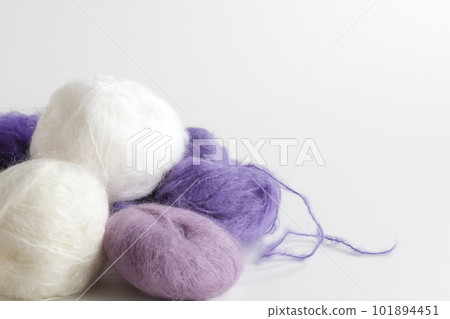 Mohair white and purple ball of yarn taken with a white background Mohair white and purple ball of yarn taken with a white background 101894451