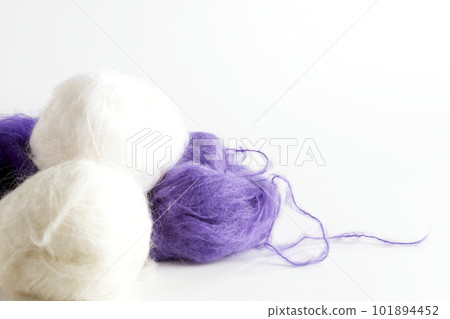 Mohair white and purple ball of yarn taken with a white background Mohair white and purple ball of yarn taken with a white background 101894452