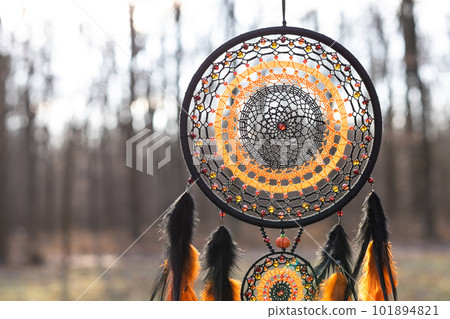 Handmade dream catcher with feathers threads and beads rope hanging Handmade dream catcher with feathers threads and beads rope hanging 101894821