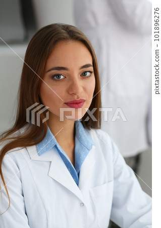 Beautiful female doctor cardiologist therapist or gynecologist in clinic 101896276
