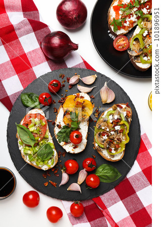 Toasts with tasty grilled vegetables, top view 101896951