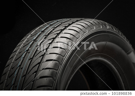 Tire close-up on a black background, side view 101898836