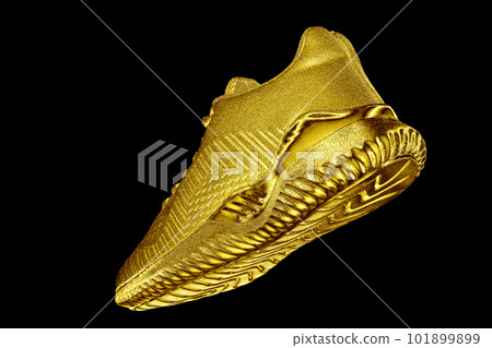 Sneakers. Golden sneaker on black background Sneakers. Golden sneaker on black background 101899899