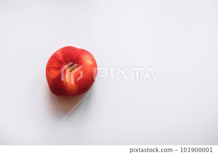 one ripe donut peach on a clean white background top view negative space 101900001