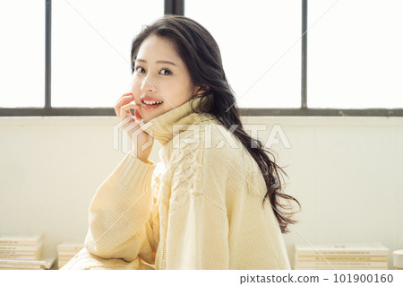 Portrait of a woman in a knitted sweater Portrait of a woman in a knitted sweater 101900160