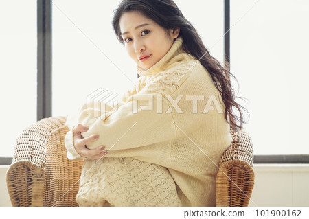 Portrait of a woman wearing a knitted dress 101900162