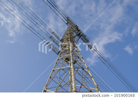 Transmission tower looking up against the blue sky Transmission tower looking up against the blue sky 101900168