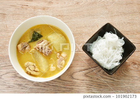 spicy boiled slice winter melon with chicken in coconut milk green curry soup on bowl eat couple rice noodles spicy boiled slice winter melon with chicken in coconut milk green curry soup on bowl eat couple rice noodles 101902173