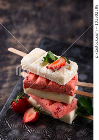 Strawberry ice cream pop sicle with mint 101902598