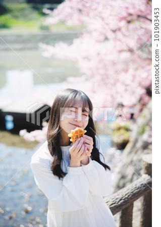 Girl eating cherry and waffles Girl eating cherry and waffles 101903453