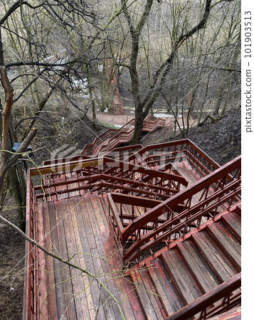 Staircase in the park. The photo shows red wooden stairs in the park. Staircase in the park. The photo shows red wooden stairs in the park. 101903513