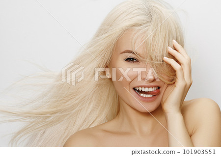 Beautiful woman with blond hair. Happy model face with long hairstyle Beautiful woman with blond hair. Happy model face with long hairstyle 101903551