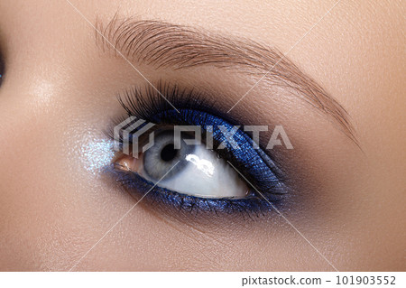 Closeup Macro of Woman Face with Blue Eyes Make-up. Fashion Celebrate Makeup, Glowy Clean Skin, perfect Shapes of Brows Closeup Macro of Woman Face with Blue Eyes Make-up. Fashion Celebrate Makeup, Glowy Clean Skin, perfect Shapes of Brows 101903552