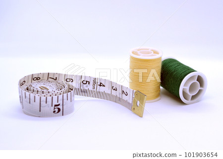 Threads and sewing ruler. Threads and sewing ruler. 101903654