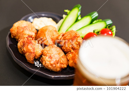 Karaage and beer are classic menu items at izakaya 101904222