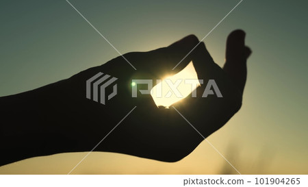 hand sunset in the sky. yoga woman at sunset. silhouette female sport. girl young nature evening. dawn outdoors. concentration. one love nature. sports one relaxation. relax outdoors. yoga. 101904265