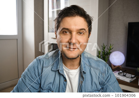 Middle aged man blogger capture himself for video blog on camera at home 101904306