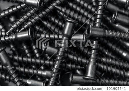 Assembly wood screws background texture. Black color. Full frame Assembly wood screws background texture. Black color. Full frame 101905541