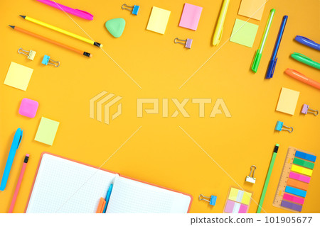 Frame of opened notebook and bright stationery on yellow background. Place for your text, flatlay. Frame of opened notebook and bright stationery on yellow background. Place for your text, flatlay. 101905677