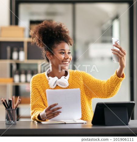 African american student woman in sweater video conference on sm 101906111