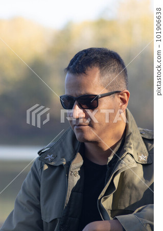 Portrait of military man at lake in autumn Portrait of military man at lake in autumn 101906638