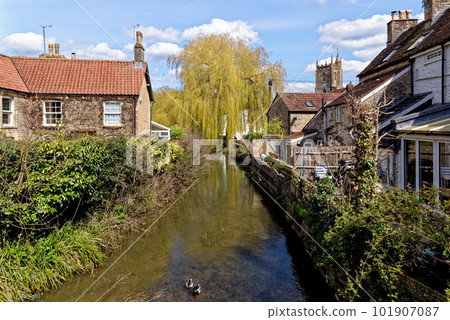 Pretty cottages and the Mells River at Nunney Pretty cottages and the Mells River at Nunney 101907087