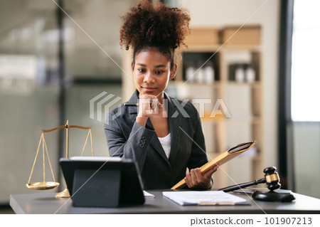 African american lawyer woman in suit holding envelope of busine 101907213