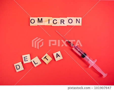Omicron variant replaces Delta. Emergence of new dangerous strain of coronavirus COVID-19 Omicron. Syringe. Words omicron delta on colored red background 101907647