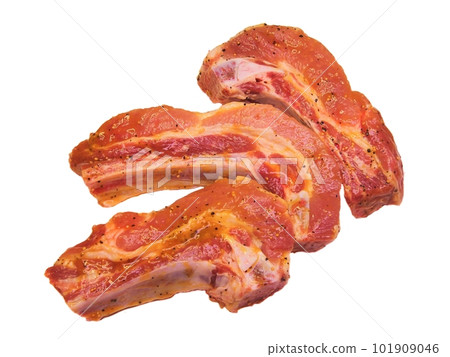 Pork rib marinated with spices a piece of meat on a white background Pork rib marinated with spices a piece of meat on a white background 101909046