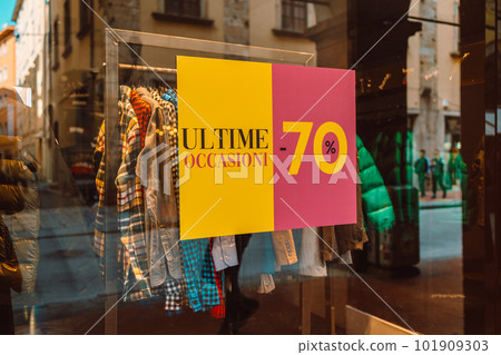 Sale banner in shop window for end of the season sales deals Sale banner in shop window for end of the season sales deals 101909303