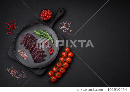 Delicious dried smoked beef or horse meat jerky with spices and salt 101910454