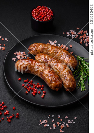 Delicious fried grilled sausages with salt, spices and herbs 101910498