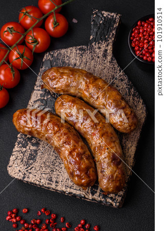 Delicious fried grilled sausages with salt, spices and herbs 101910514