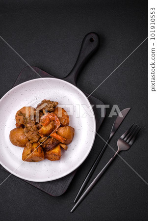 Delicious fresh cooked stew with pork meat or beef with potatoes, carrots, spices and herbs Delicious fresh cooked stew with pork meat or beef with potatoes, carrots, spices and herbs 101910553