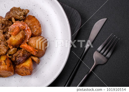 Delicious fresh cooked stew with pork meat or beef with potatoes, carrots, spices and herbs Delicious fresh cooked stew with pork meat or beef with potatoes, carrots, spices and herbs 101910554